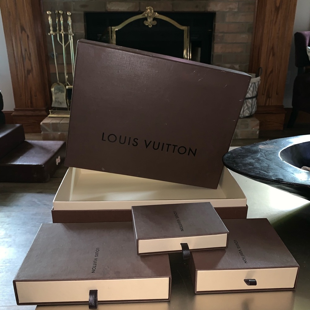 A set of empty Louis Vuitton storage boxes